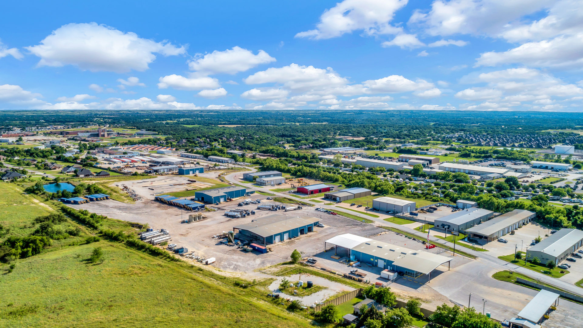Zoomed-out aerial view of the Bear Cat Industrial Park consisting of four different industrial buildings