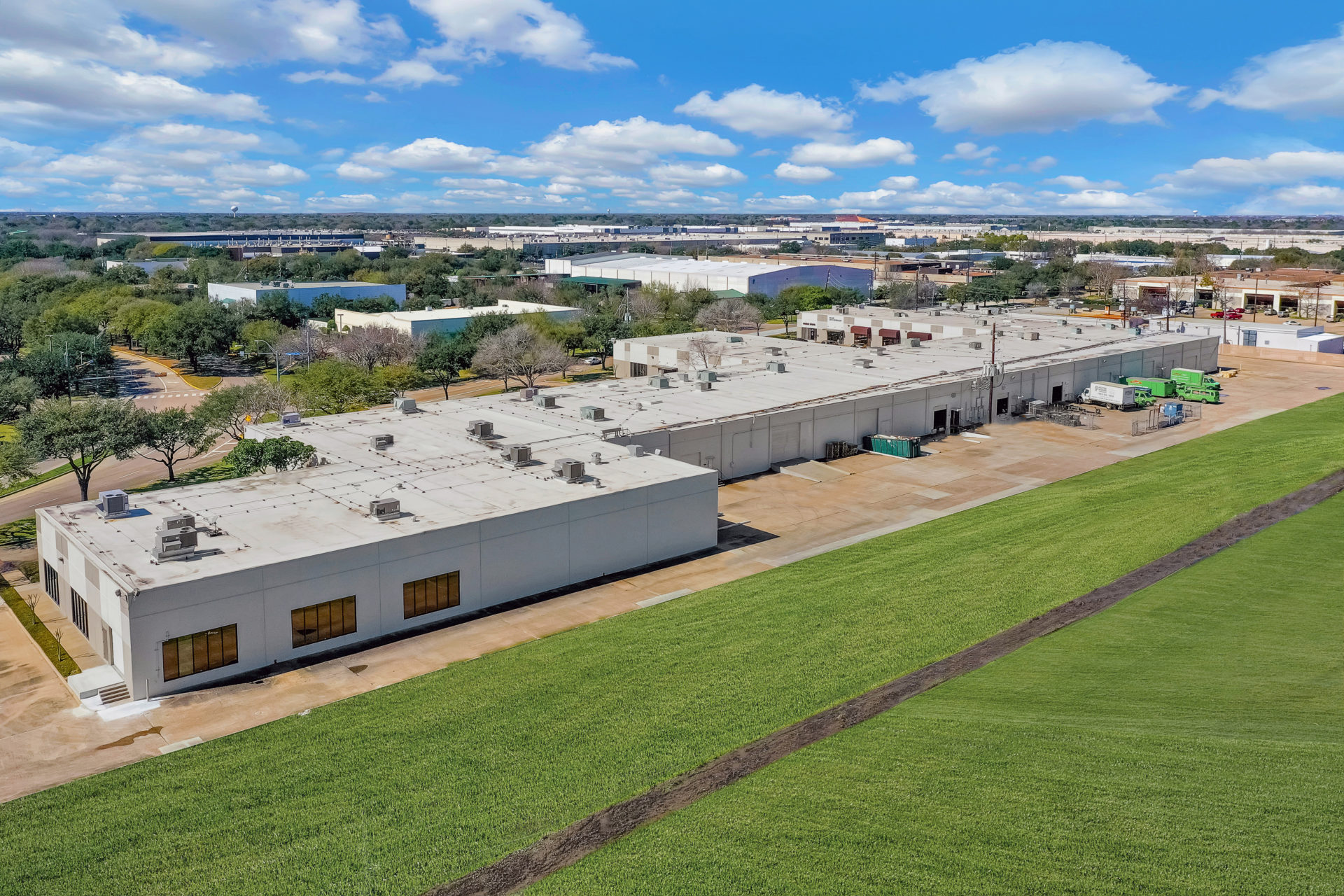 Aerial view of the backside of 700 Industrial Boulevard showing multiple loading docks and space for truck parking